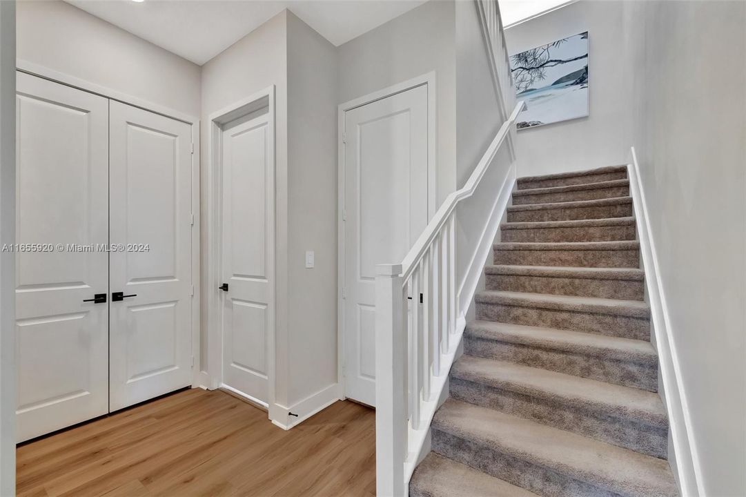 Doors to a storage closet and cabana bathroom