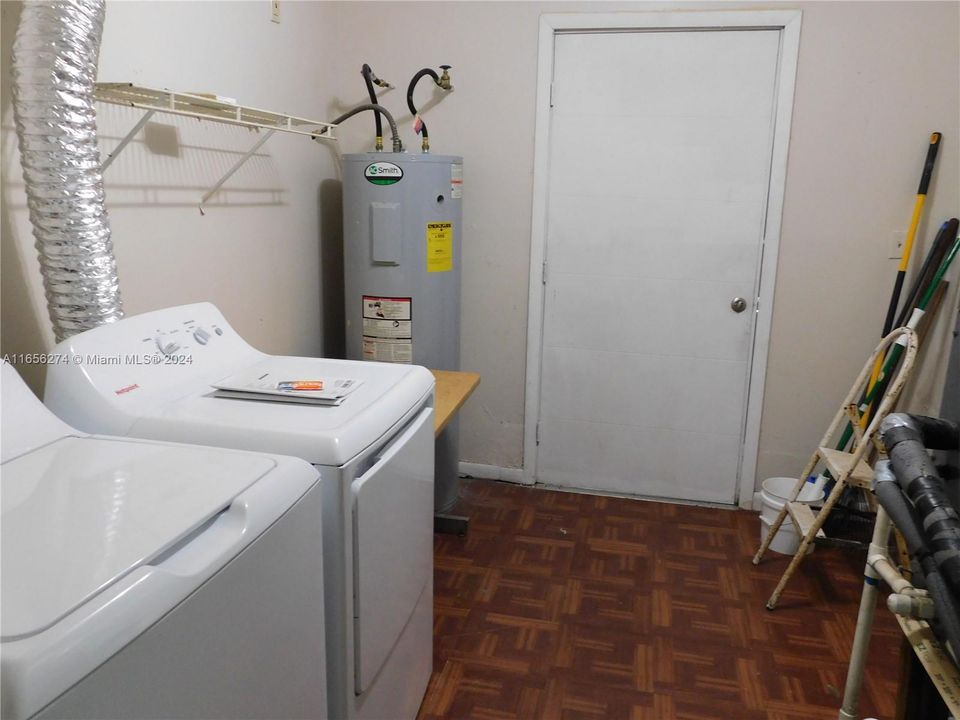 inside utitlity room with brand new washer and dryer