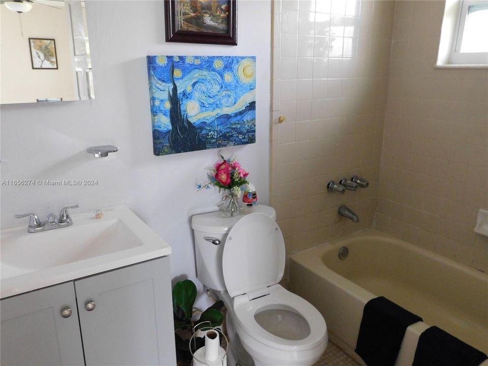 master bath with new vanity and toilet