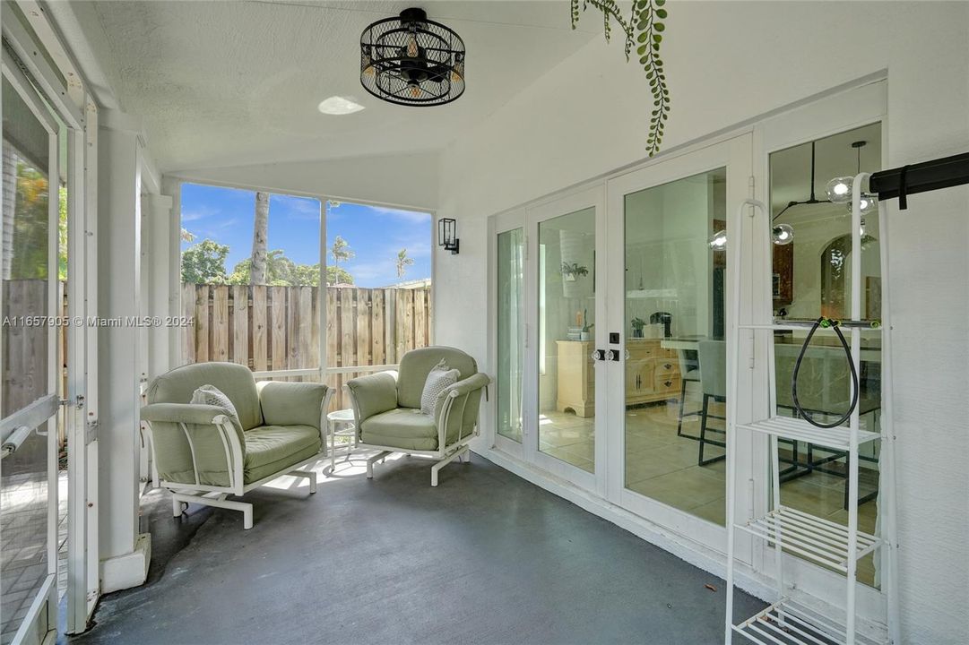 Outdoor screened patio overlooking the zen-inspired, manicured, fully fenced garden