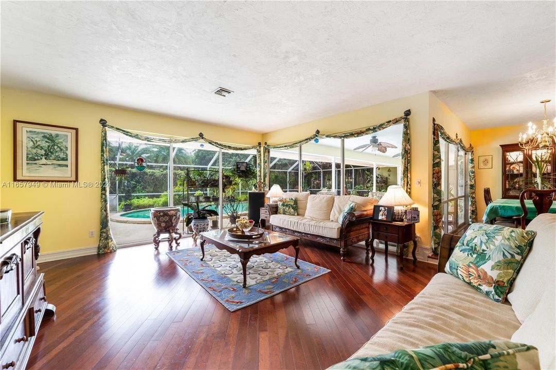 Gleaming wood floors in living/ dining area