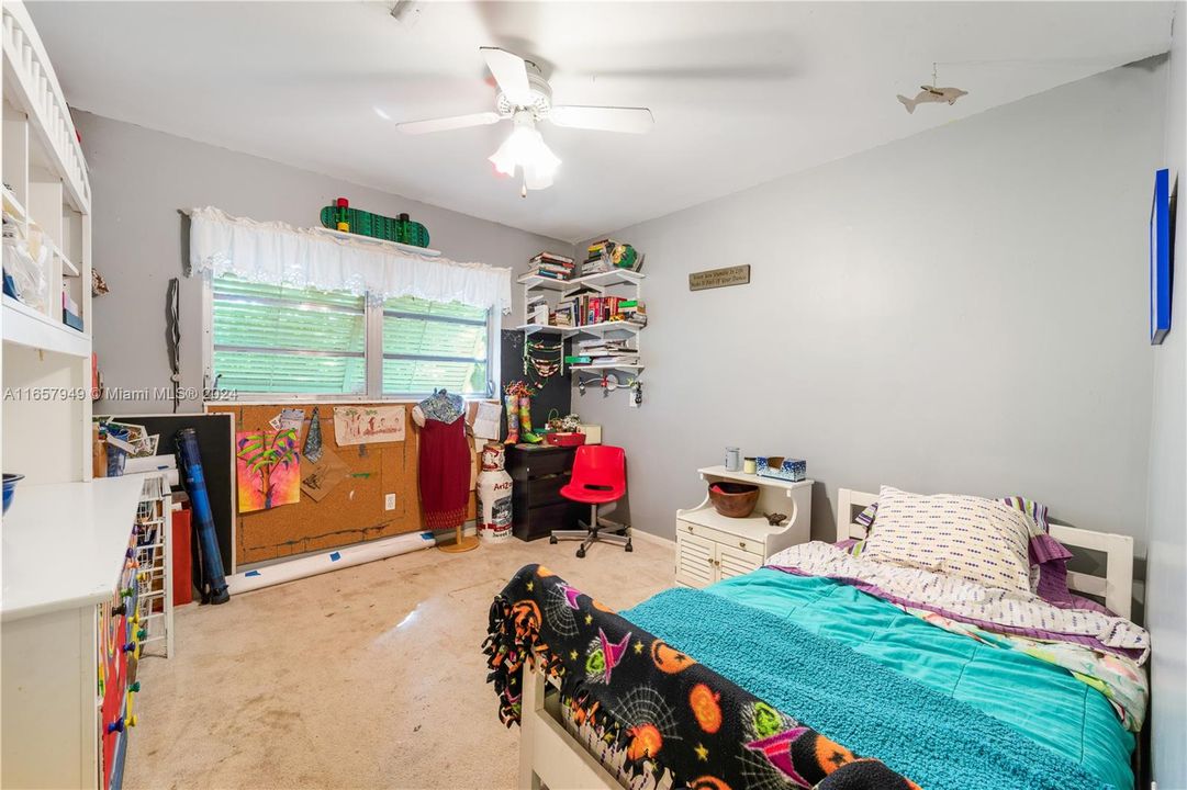 One of 4 bedrooms...Note: there is terrazzo underneath the carpet!