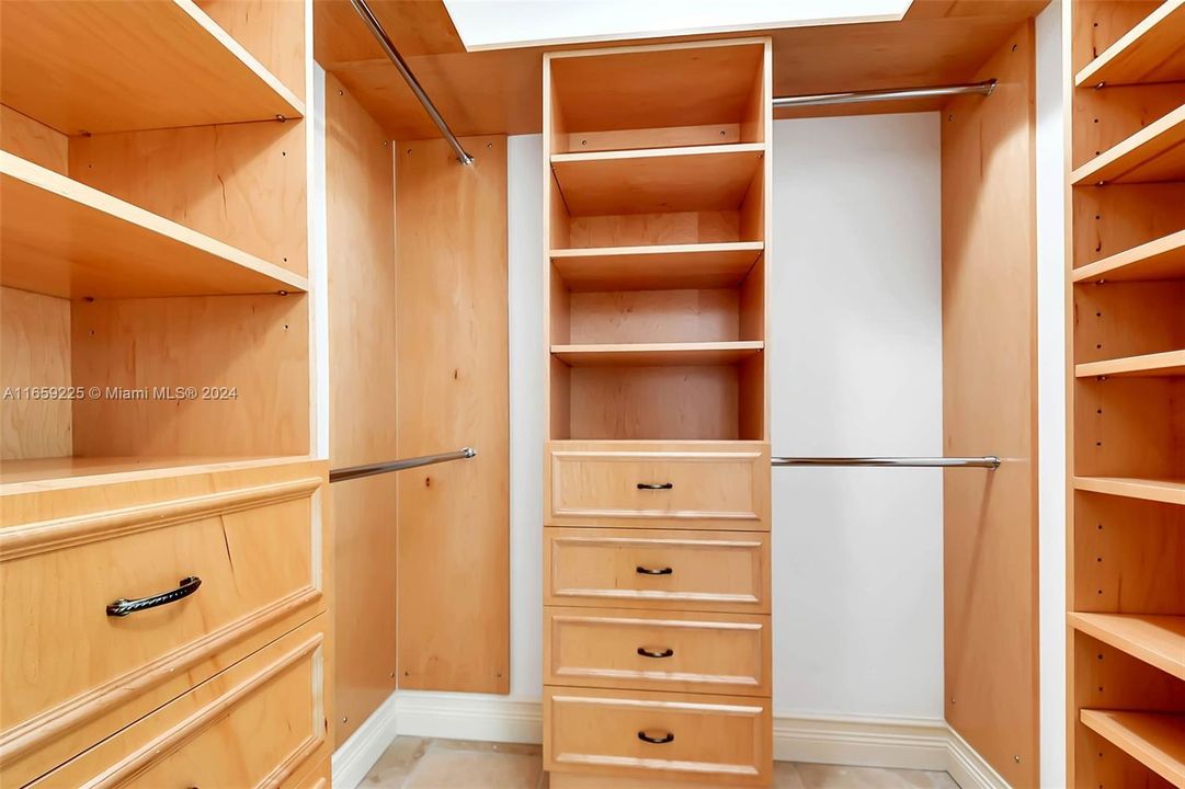 Primary bedroom walk in closet