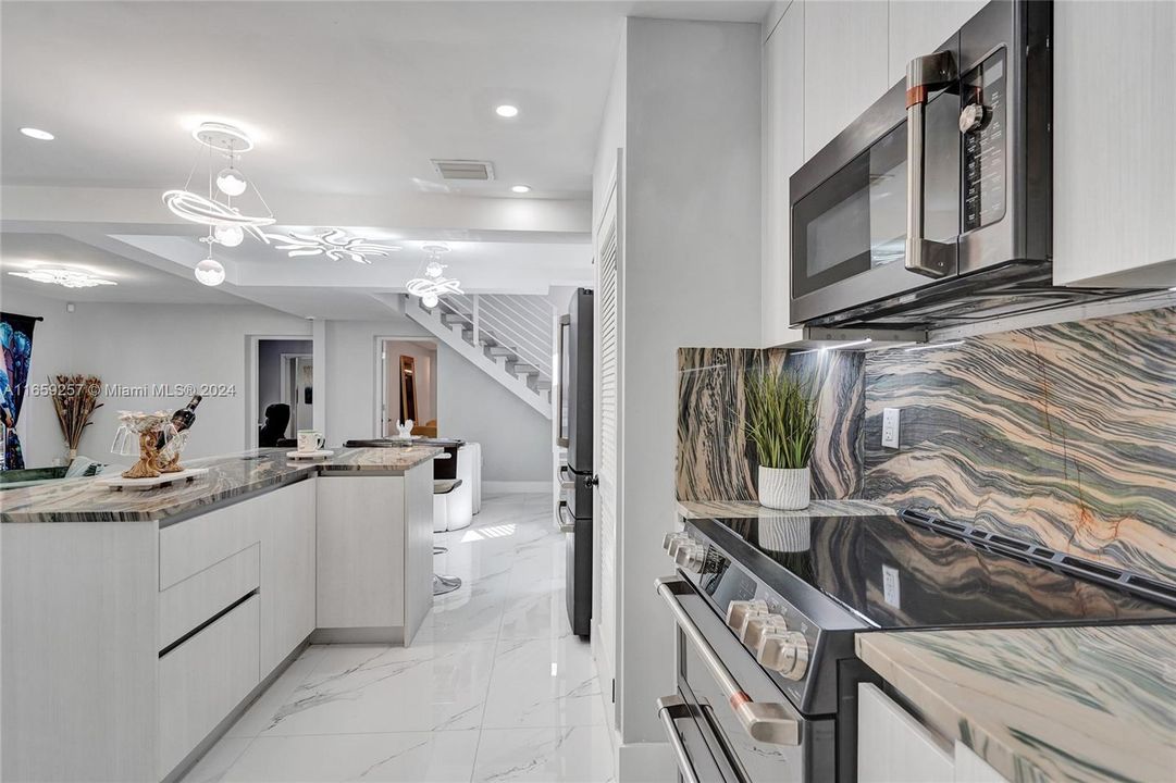 Brand new kitchen with the most luxurious appliances found on the market: “Café”, and Quartzite countertops and backsplash, a rarest stone more expensive and durable than granite.