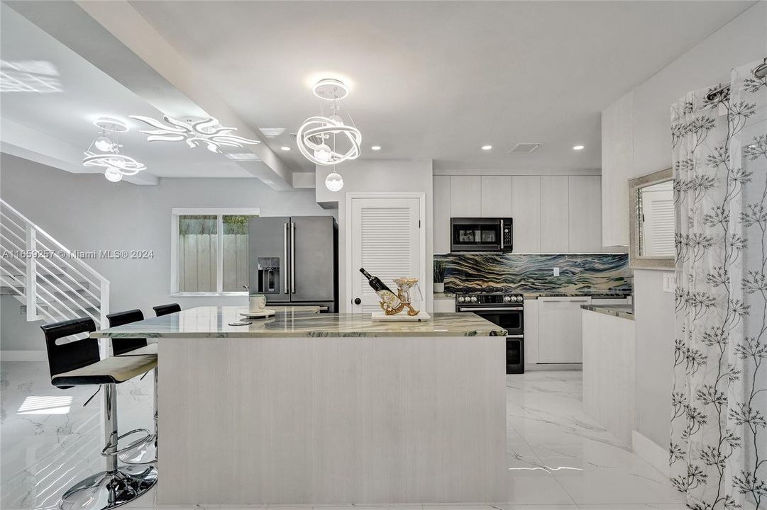 Brand new kitchen with the most luxurious appliances found on the market: “Café”, and Quartzite countertops and backsplash, a rarest stone more expensive and durable than granite.