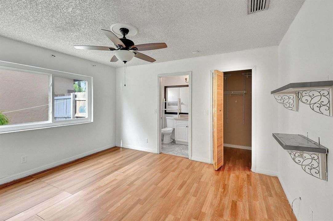 Primary bedroom with walk in closet