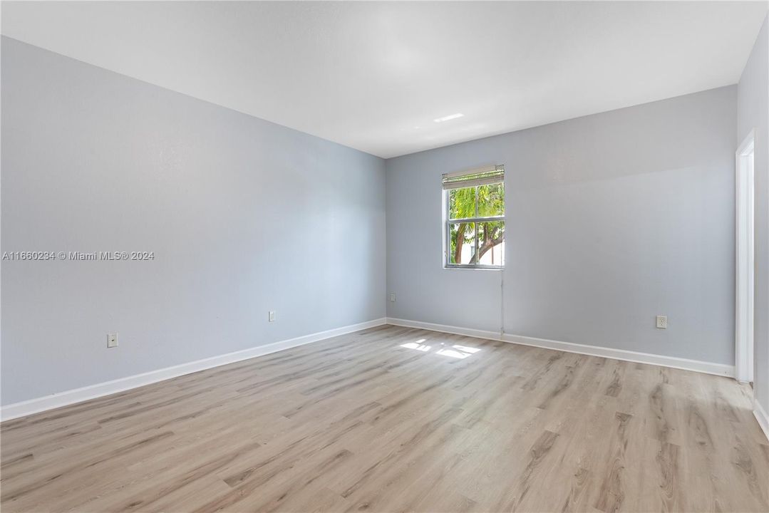 PRIMARY BEDROOM UPSTAIRS WITH BRAND NEW FLOORING