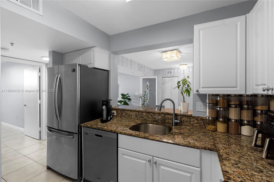 Spacious kitchen with a full-size refrigerator.