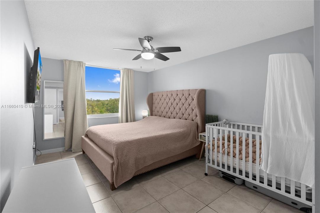 Spacious master bedroom that can accommodate a king-size bed and more.