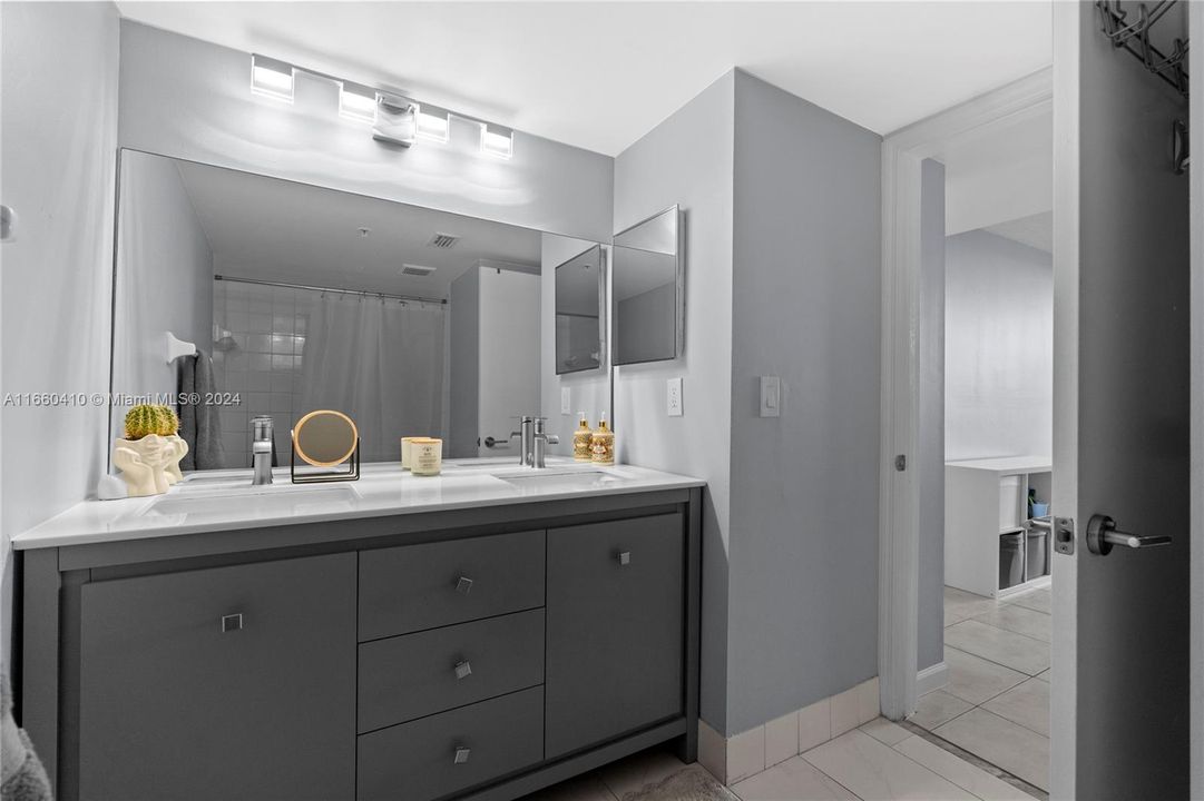 The master bathroom features two sinks.