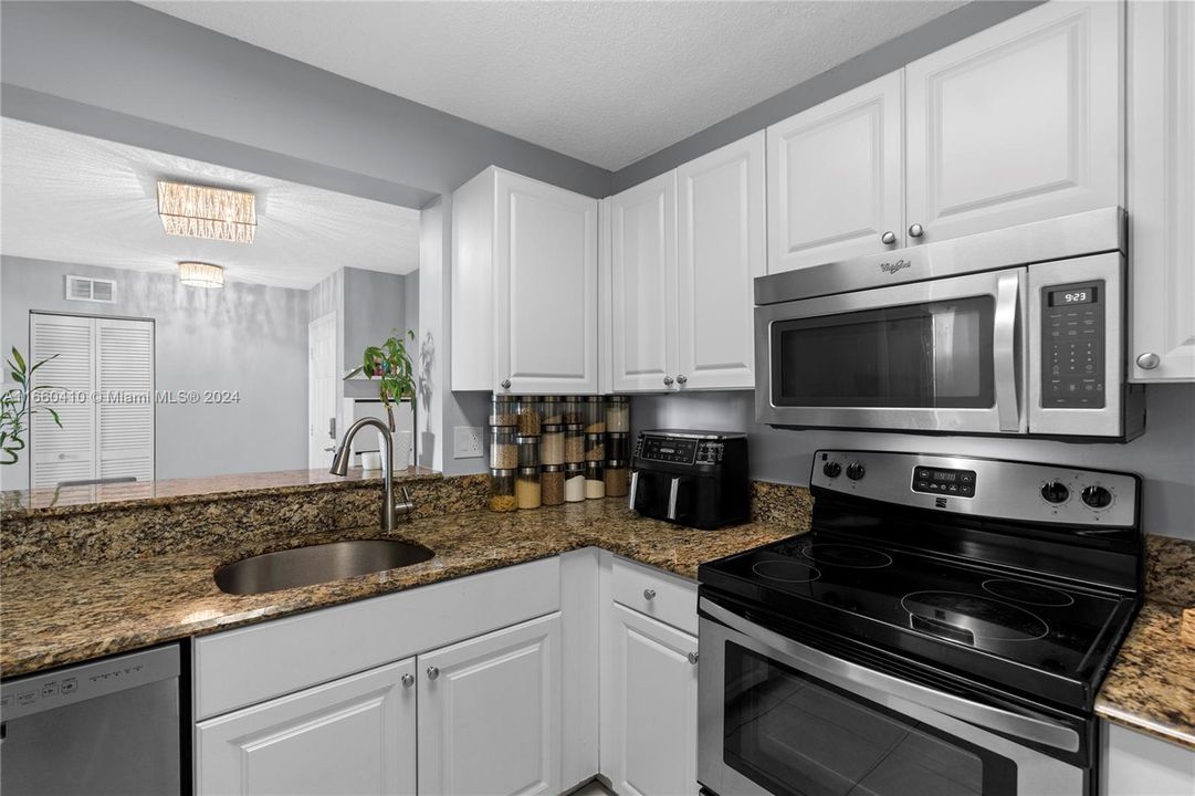 Spacious kitchen with a breakfast snack counter.