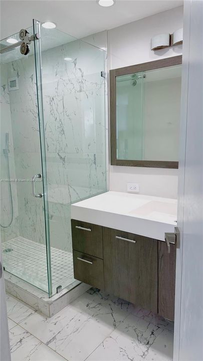 remodeled bathroom with opened ceilings