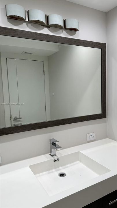 Large mirror and spacious cabinet