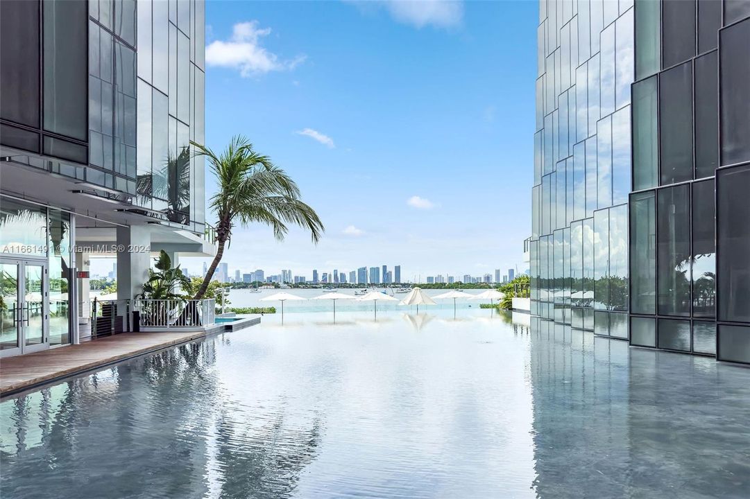 water feature in back of building overlooking the pool