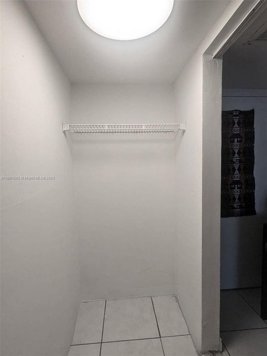 Freshly painted, spacious walk-in closet.