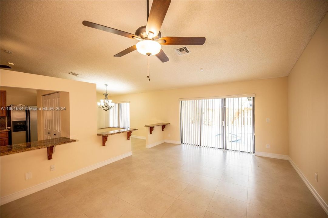 FAMILY ROOM OFF KITCHEN AND DINING ROOM LEADING TO THE POOL AREA