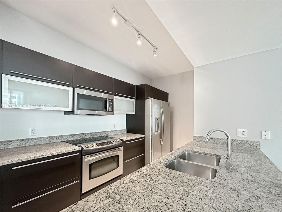 Stainless steel appliances, dishwasher next to the sink