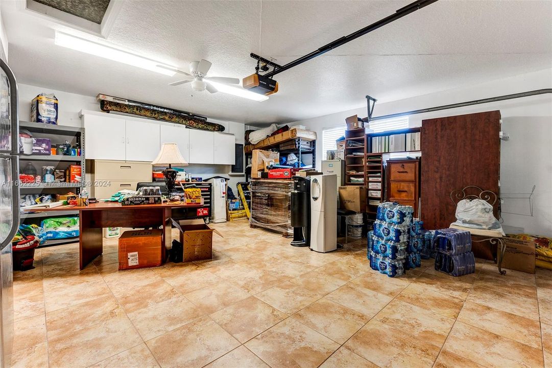 The garage is insulated, has a ceiling fan and the flooring is tiles, making it a perfect space for a home office, playroom or other use you think of.