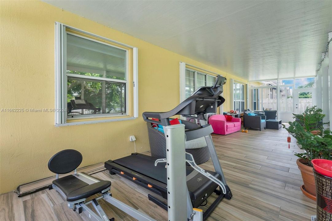 The patio is large enough to have a work out area and a seating area.