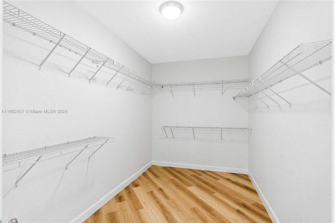 Primary Bedroom walk in closet