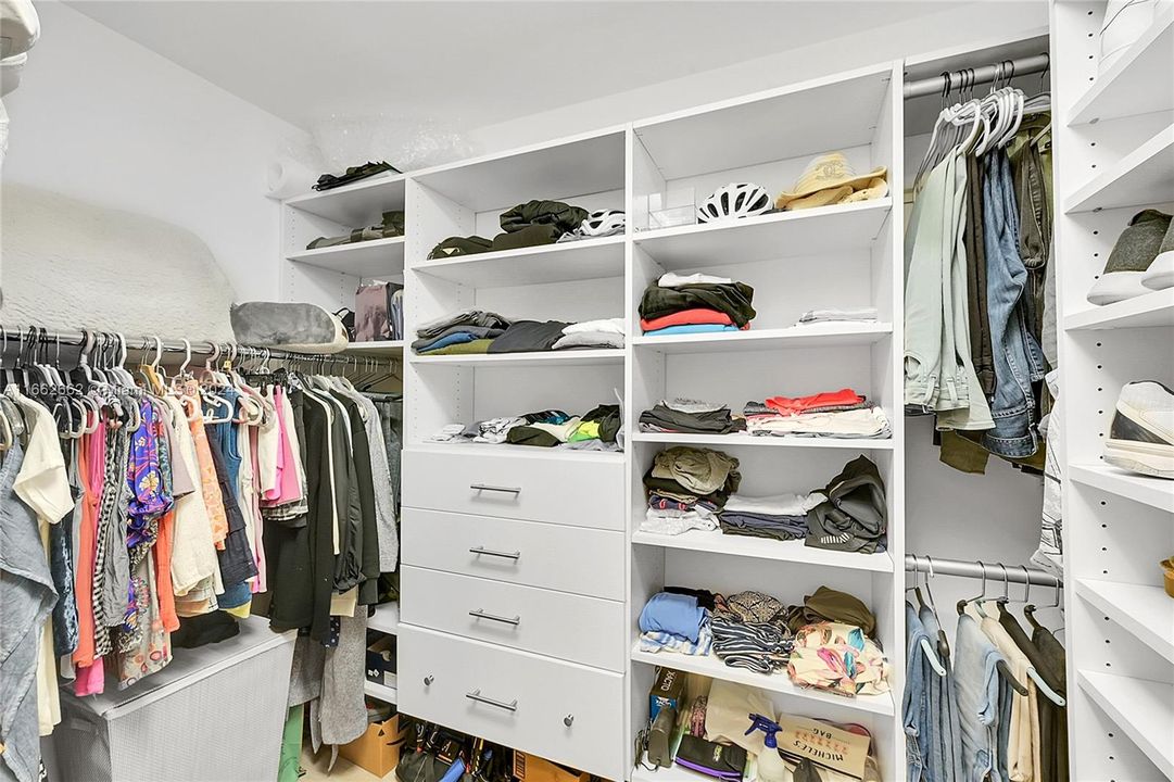 Custom shelving in walk-in closet