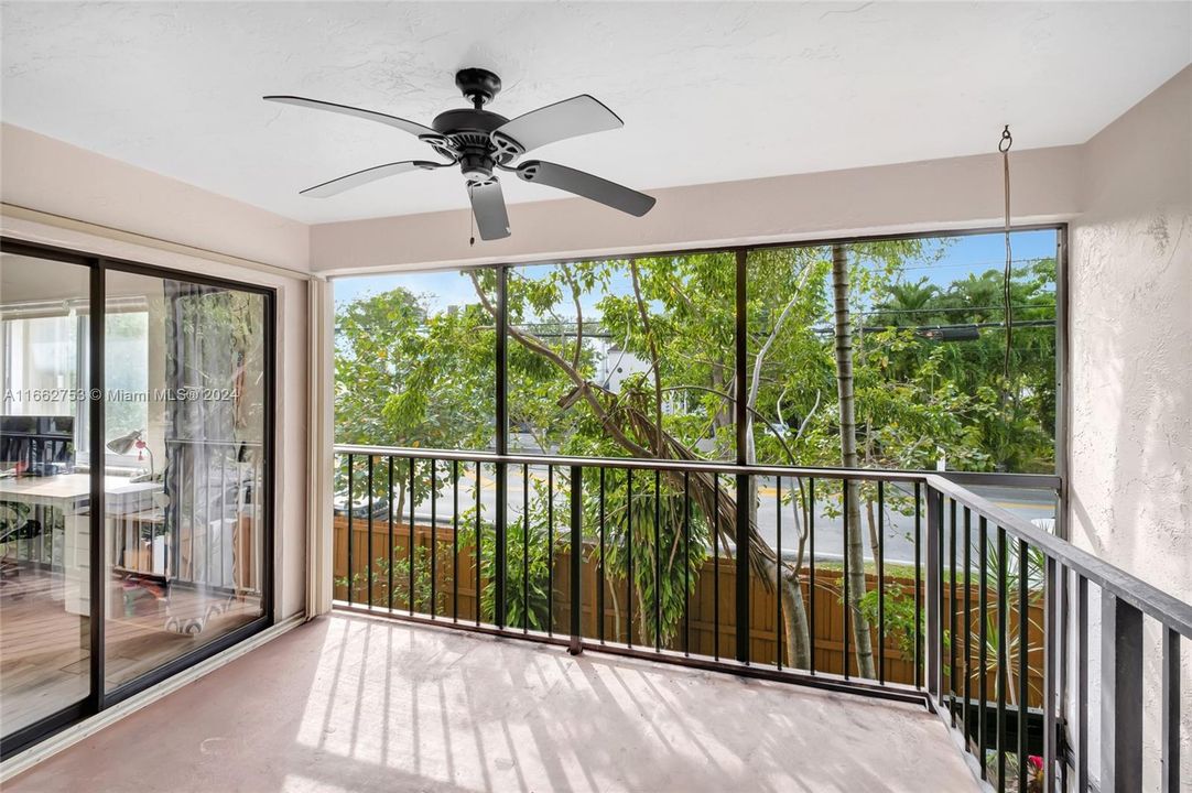 Screened balcony/sunroom upstairs is accessed from both bedrooms