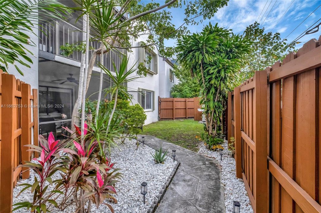 Courtyard front entranced is fenced, creating an "outdoor room"