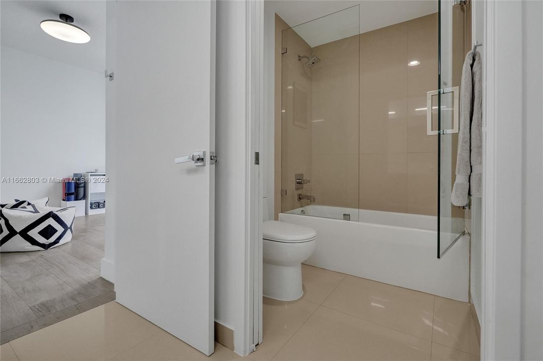 Second Bathroom has a custom shower enclosure.