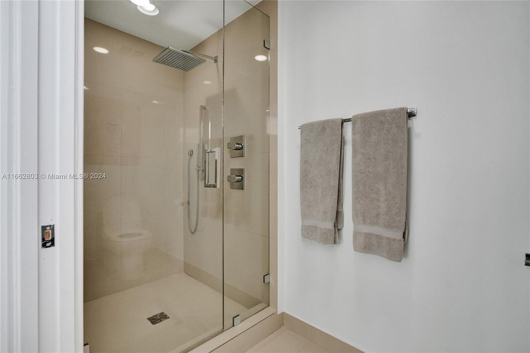 Sellers added the shower glass enclosure.