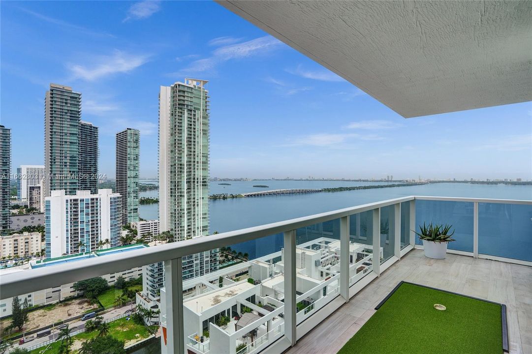 This living room has a large wrap around balcony that is 233 square feet.