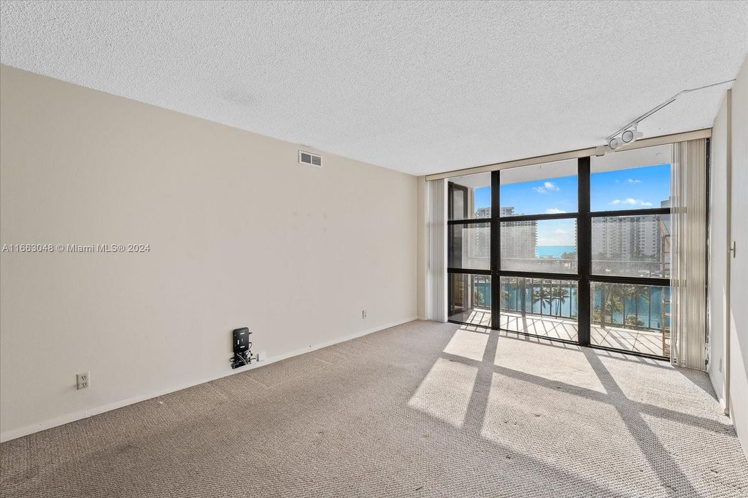 Main Bedroom with panorama windows and Water Views!Three Islands, Hallandale Beach - Unit #824 at 1000 Parkview Drive - available For Sale.