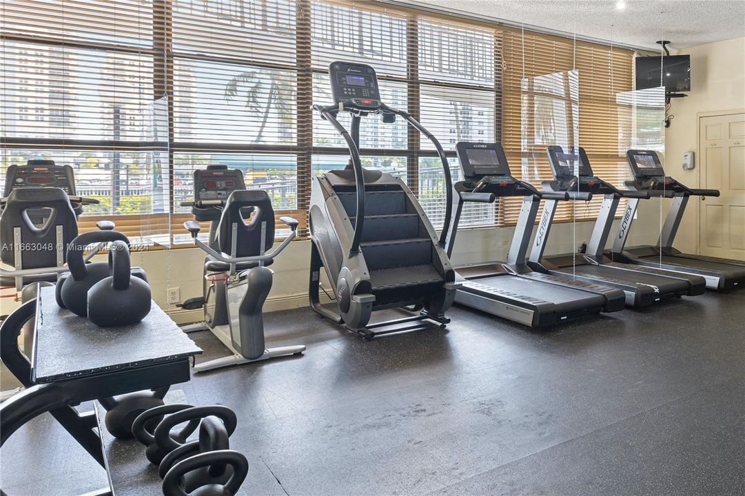 Cardio Training with modern equipment and pool view. Oceanview Park Condominium. Hallandale Beach, Florida - Three Islands - Unit #824.