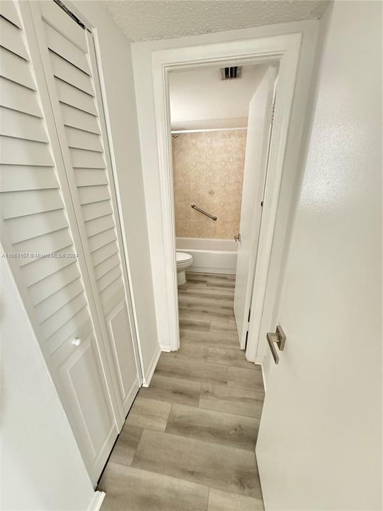 hallway to bathroom