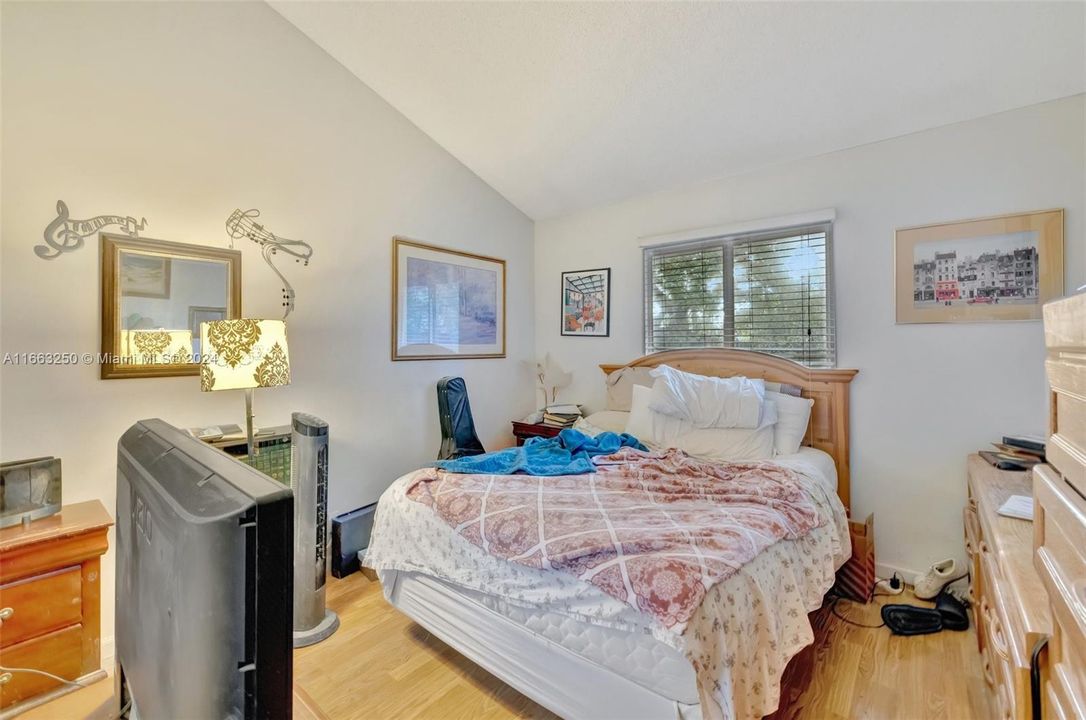 Primary Bedroom fits King Bed and lots of furniture. Volume Ceiling