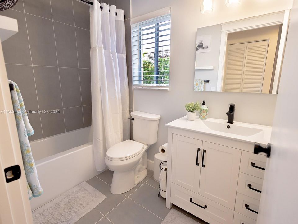 Remodeled secondary bathroom with tub