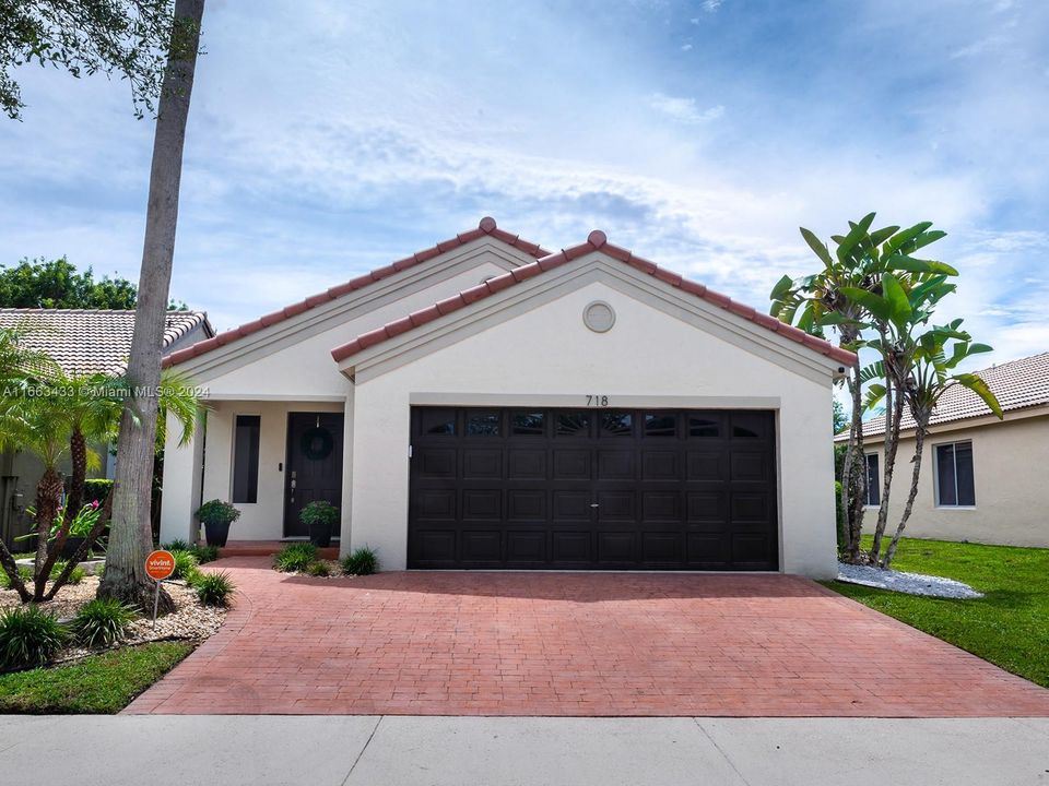 Wide paved driveway offers a beautiful curb appeal