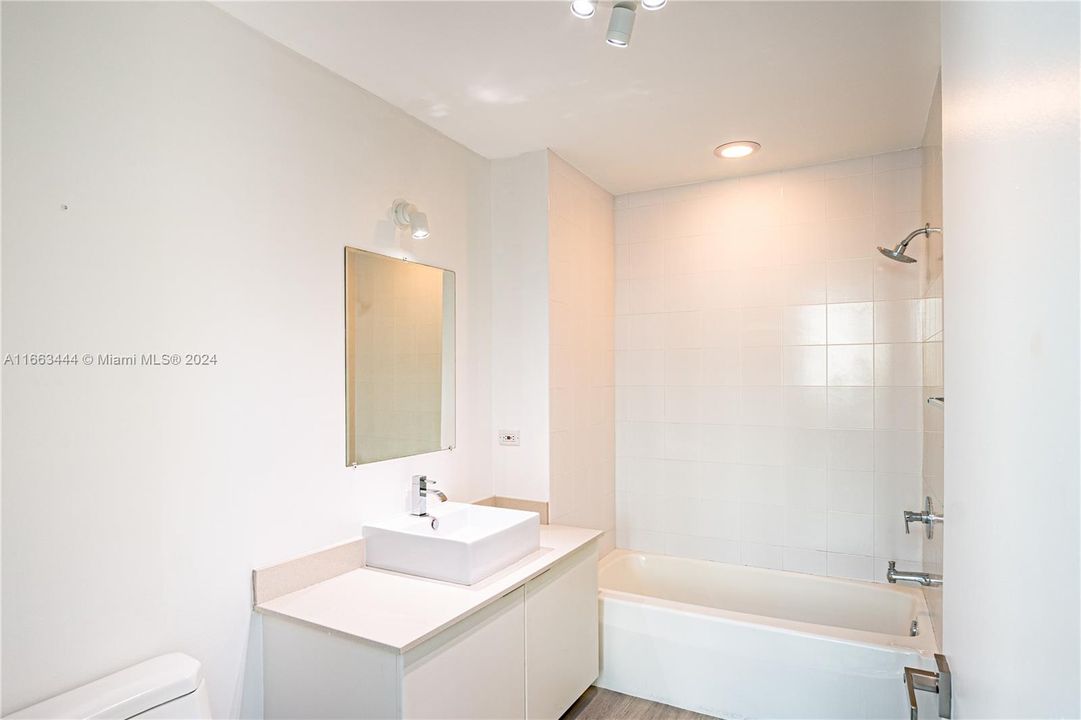 Downstairs bathroom with bathtub