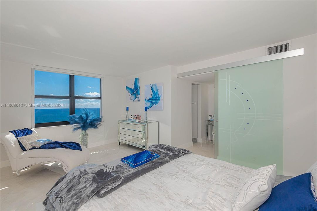 MASTER BEDROOM WITH A VIEW OF ATLANTIC OCEAN