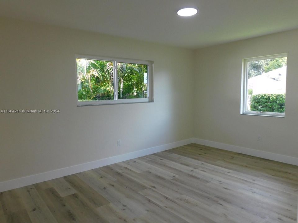 Primary bedroom at the rear of the properties with pleasant view to the patio.