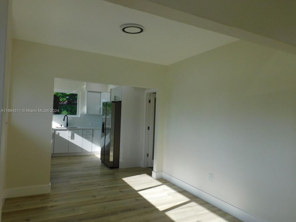 Kitchen opens to dining area for ease of entertaining.