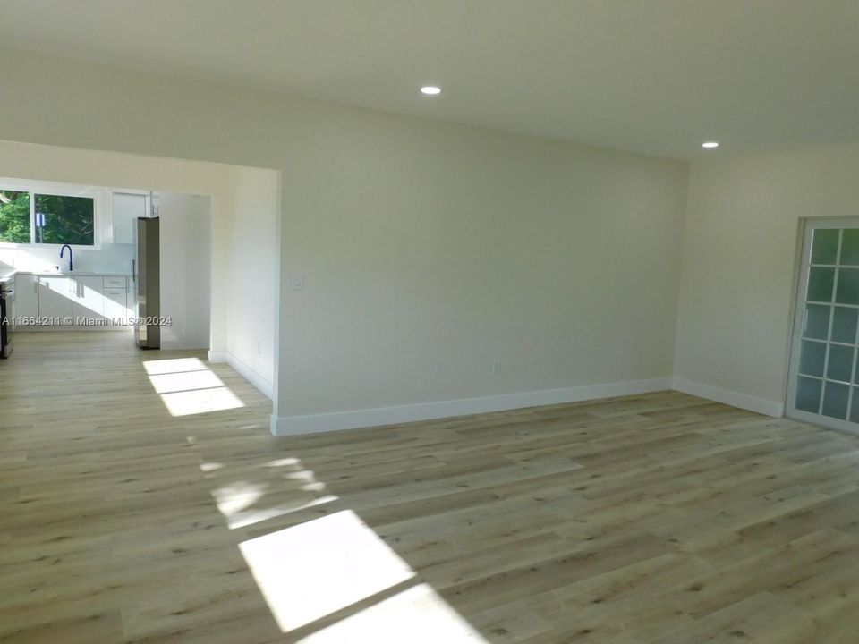 Entrance view to living areas - beautiful and new designer vinyl plank flooring, freshly painted and all brand new inside.