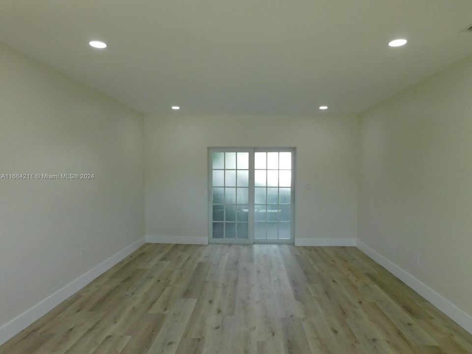 Living room with access door to patio - interior with LED High hats throughout.