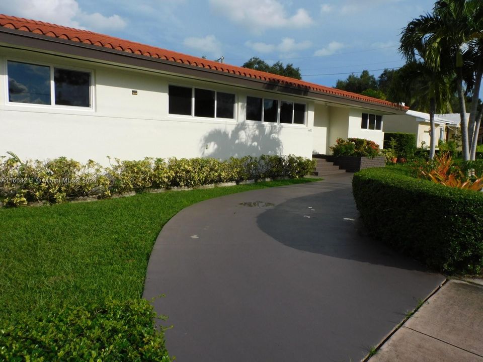 Circular driveway provides ample parking.