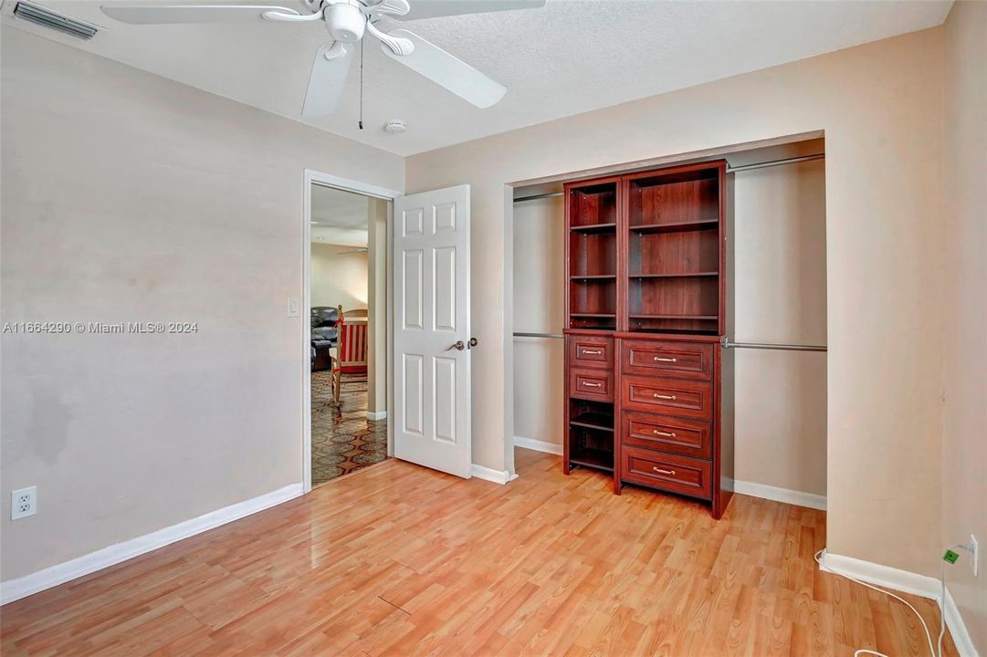 Third bedroom with built in dresser.