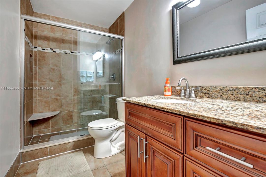 Updated bath features granite counters.