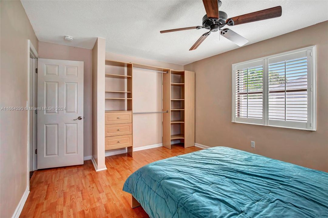 Second bedroom offering built-in-closet and Bahama shutters.