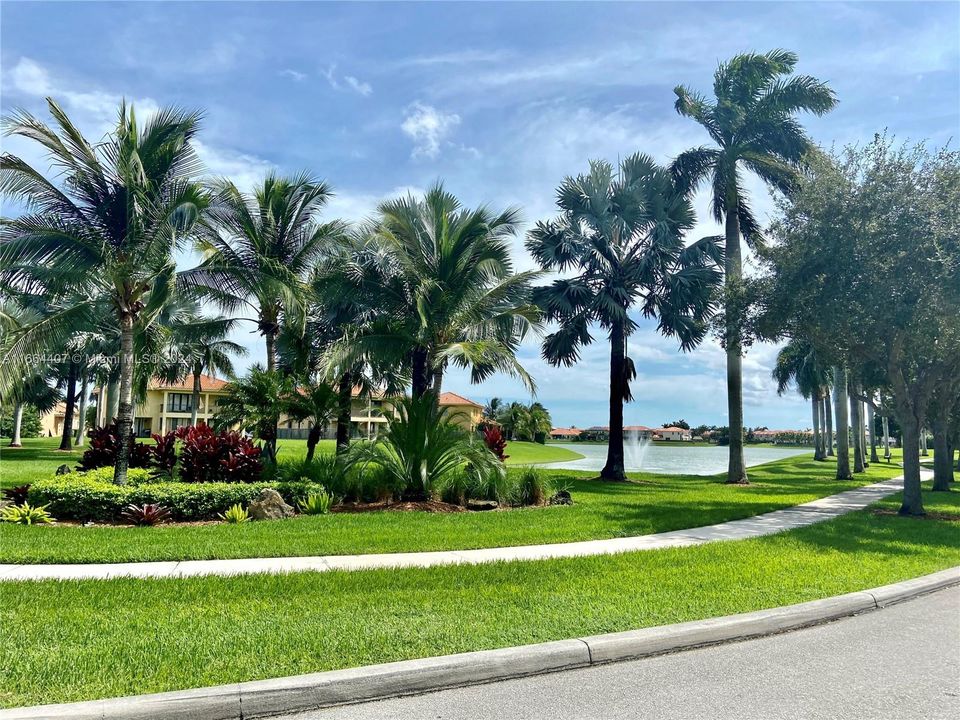 Lakefront community with lighted walking paths around lake.