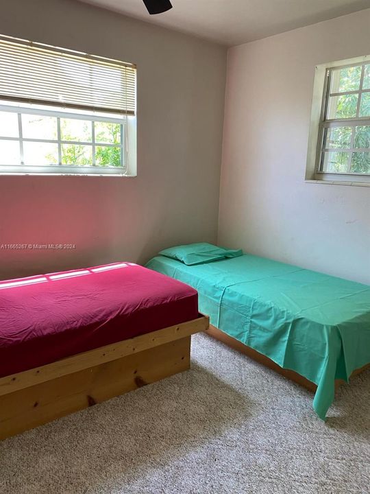 The second bedroom is ideal for a guest room, child’s room, or home office. With plenty of space for a full-sized bed and storage, this room offers versatility and comfort, making it an inviting and functional space.