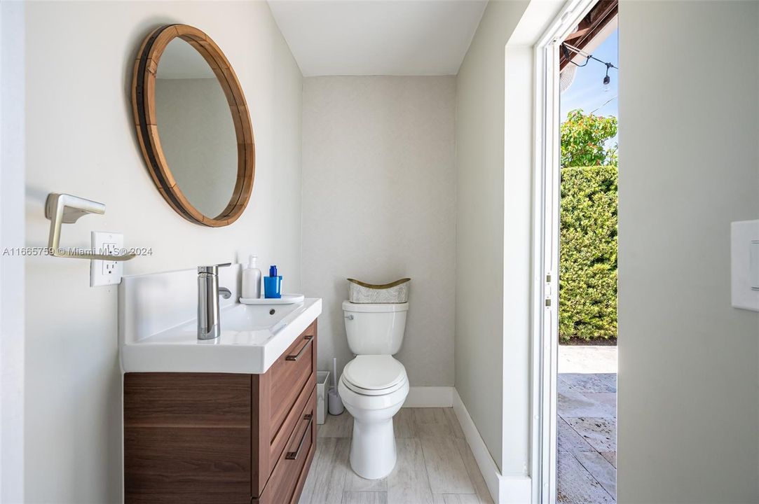 Half Bath with Access from the backyard and Family Room