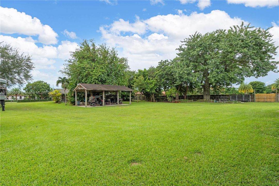 1.33 AC REMODELED 3/2 HOME W/ 2 BARNS (7 STALLS) 3 CAR GARAGE, PADDOCKS, WALKER, 2 WATER FEATURES